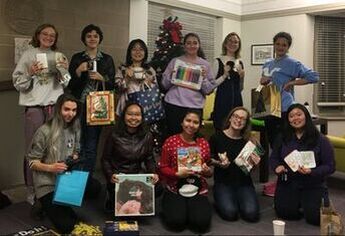 Hobartians showing off their gifts from the secret sibling gift exchange